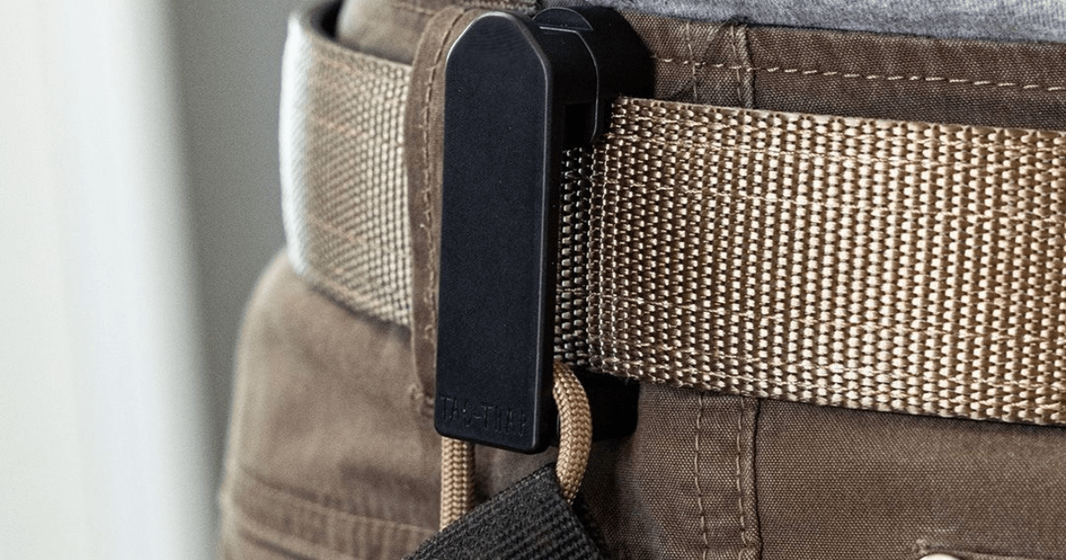 A black NeoMag Tac-Trap connected to a brown belt.