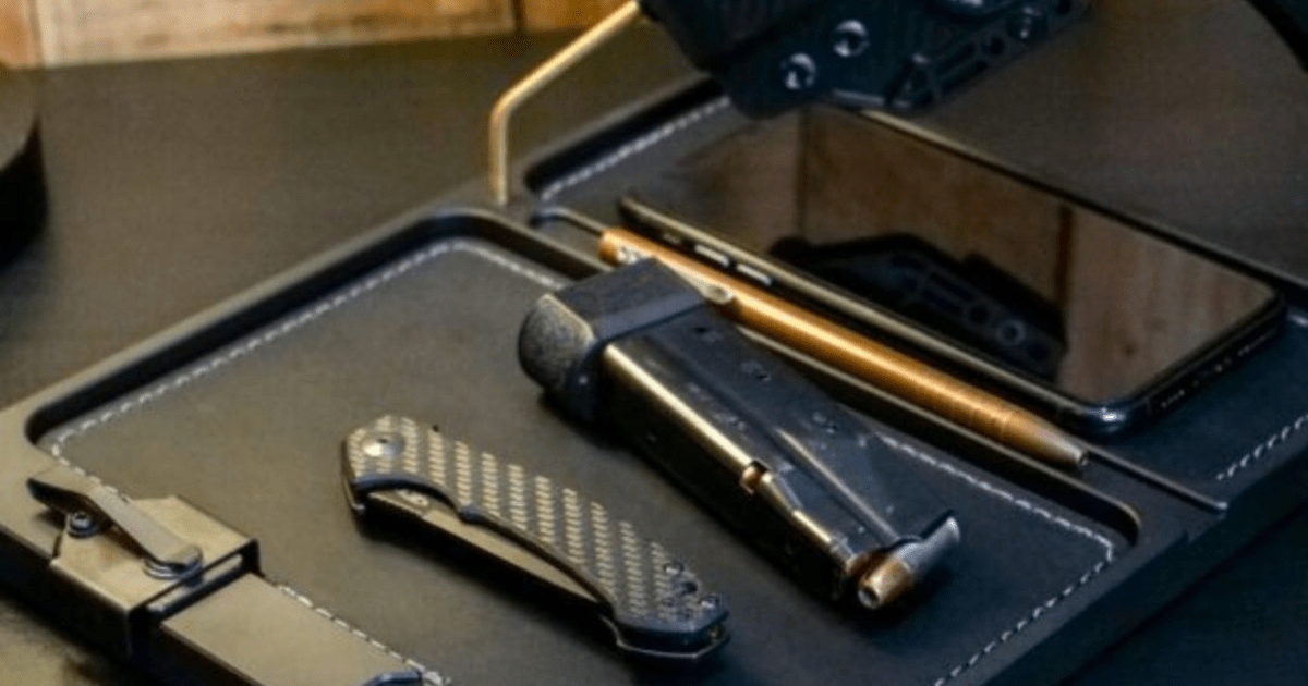An edc tray by NeoMag for edc items that includes a charing station for phone.