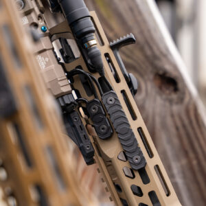 RIGS rifle integrated grip system handguard covers on rifle with laser and flashlight.