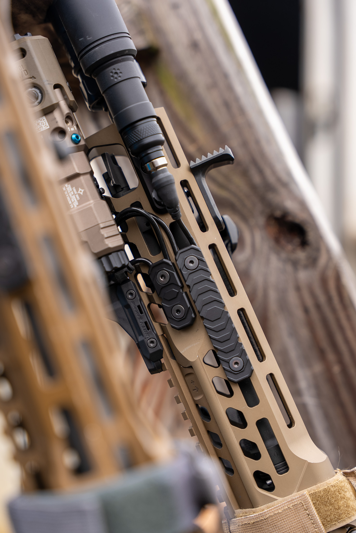 RIGS rifle integrated grip system handguard covers on rifle with laser and flashlight.