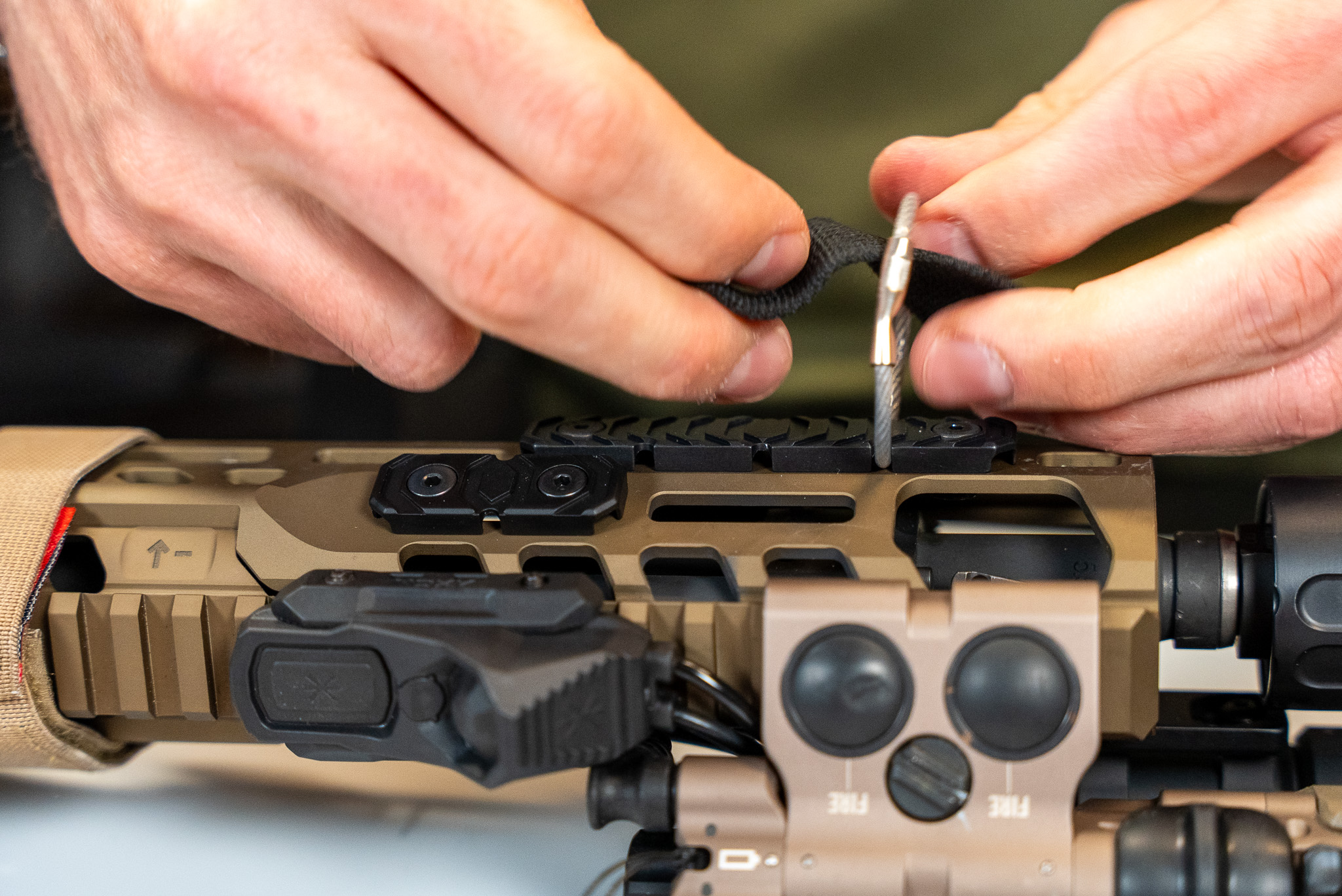 Assembling a sling on a R.I.G.S. Handguard cover and RIGS Sling Ring.