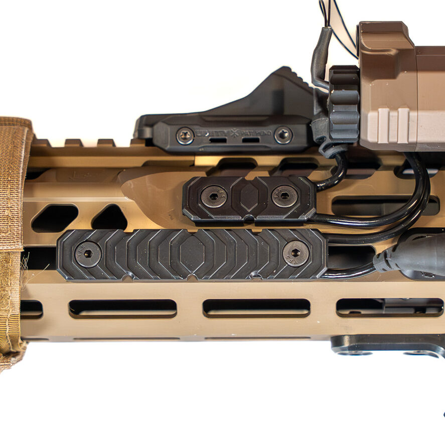 RIGS rifle integrated grip system handguard covers on rifle with laser and flashlight.